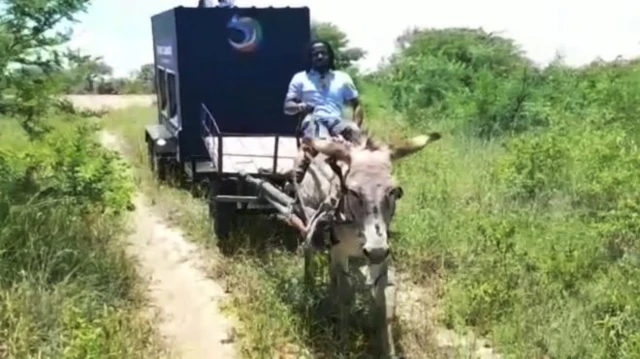 Man riding donkey