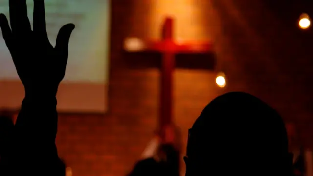 Generic photo of a man in church