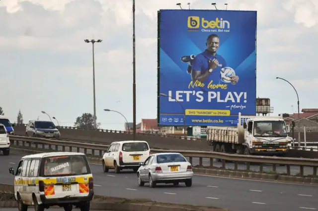 A billboard advertising a popular sports betting site is seen along a highway in Nairobi, on November 8, 2017.