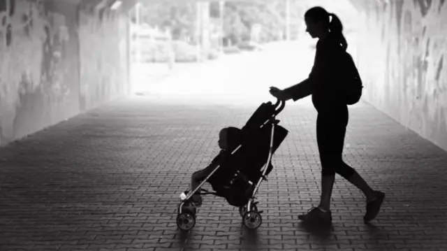 Woman with pushchair