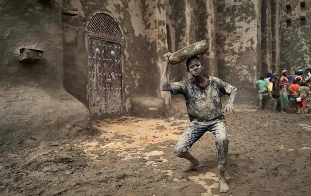 Man covered in mud