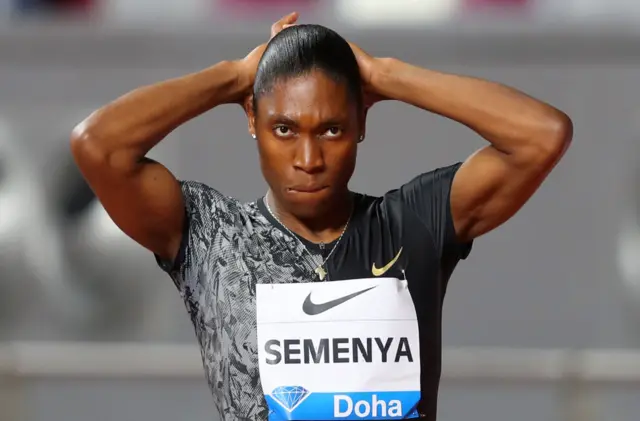 Semenya with her hands on her head