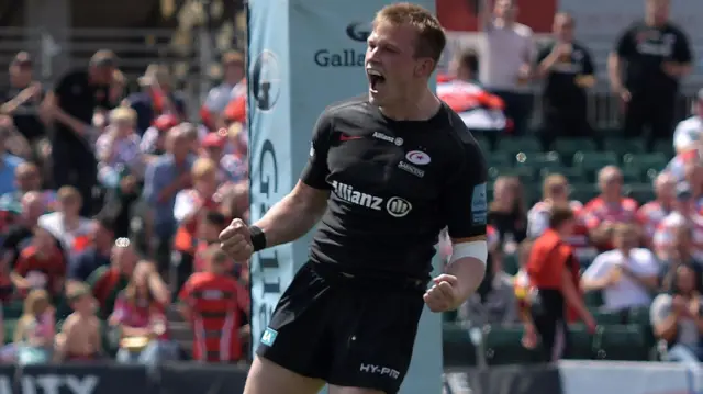 Nick Tompkins celebrates scoring a try for Saracens