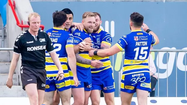 Blake Austin celebrates a try against Hull KR