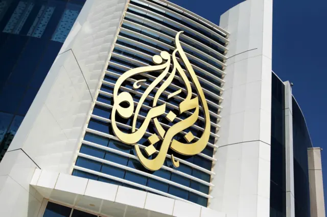 al jazeera logo on a building