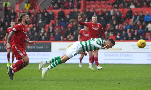 Mikael Lustig nods Celtic in front at Pittodrie