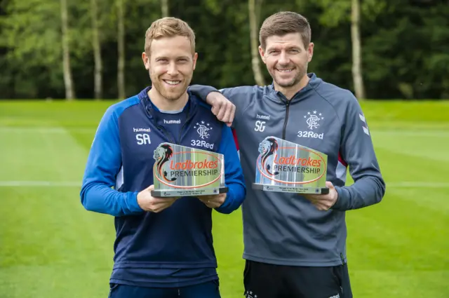 Scott Arfield and Steven Gerrard show off their monthly prizes