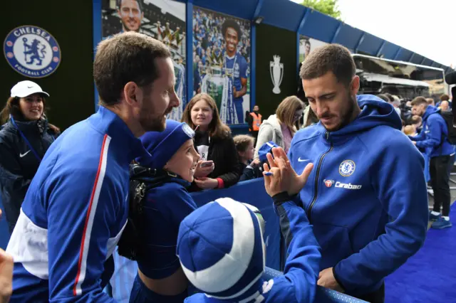 Eden Hazard greets young fans at Stamford Bridge