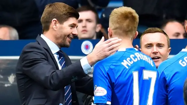 Steven Gerrard congratulates stand-in goalkeeper Ross McCrorie