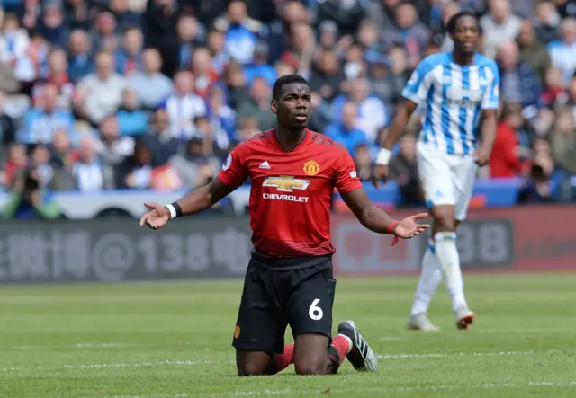 Paul Pogba with arms aloft