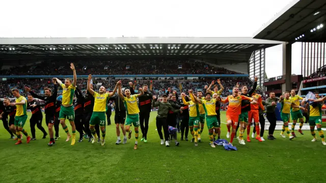 Norwich players celebrate winning the Championship
