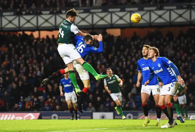 Darren McGregor powered in a late header to earn Hibs a draw at Ibrox on Boxing Day