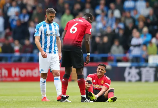 Alexis Sanchez down injured