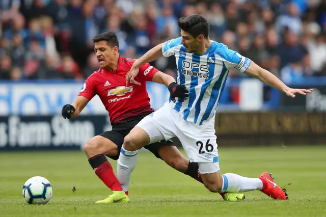 Alexis Sanchez is tackled