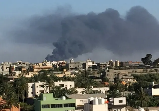 Smoke rises during a fight between members of the Libyan internationally recognised government forces and Eastern forces in Ain Zara, Tripoli, Libya May 5, 2019