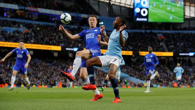 Johnny Evans and Raheem Sterling