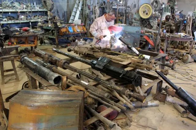 A Libyan volunteer repairs a weapon belonging to the Members of the Libyan internationally recognised government forces at a workshop in Misrata, Libya May 2, 2019