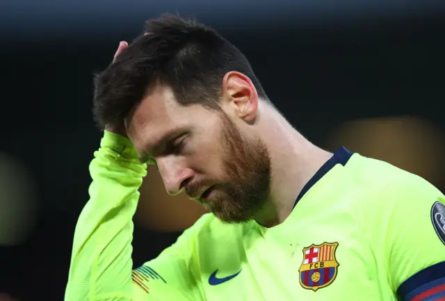 Lionel Messi with his head down