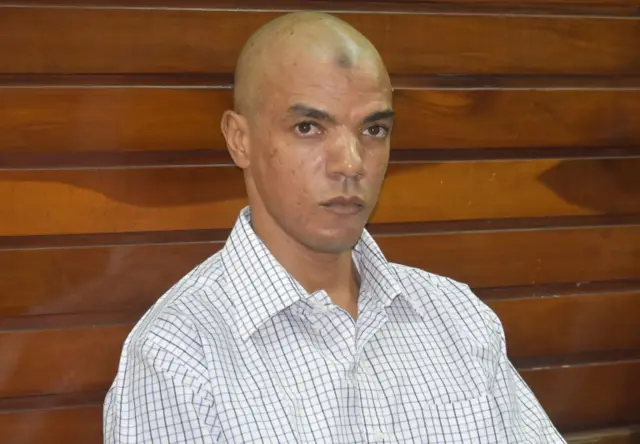 British national and terror suspect Jermain Grant follows proceedings, during which he was found guilty of being in possession of explosive making materials, at Mombasa Court, Kenya, on April 24, 2019.