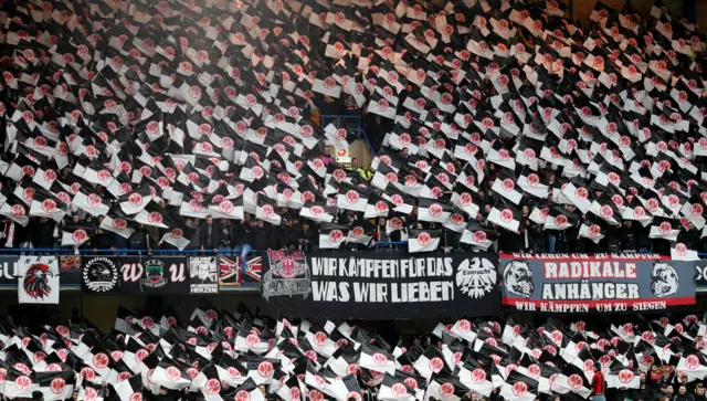 Frankfurt fans hold up flags before the game