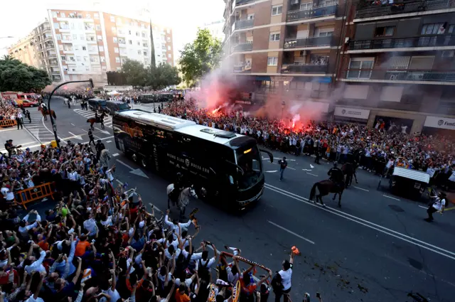 Valencia team bus cheered through the streets as home players make their way to the Valencia fans make their way to the Mestalla.