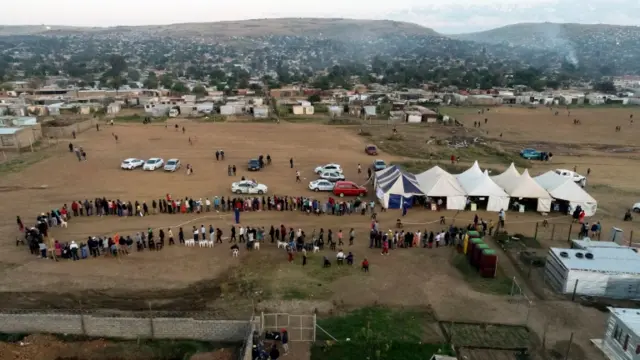 People queue outside the Brazaville voting station in Pretoria to cast their votes during South Africa"s national and provincial elections on May 8, 2019