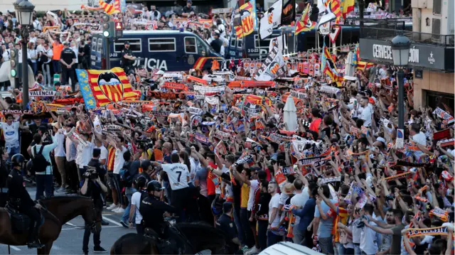 Valencia fans make their way to the Mestalla