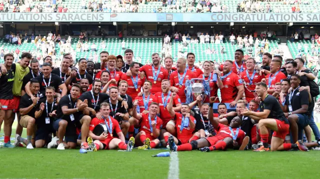 Saracens celebrate with the Premiership trophy