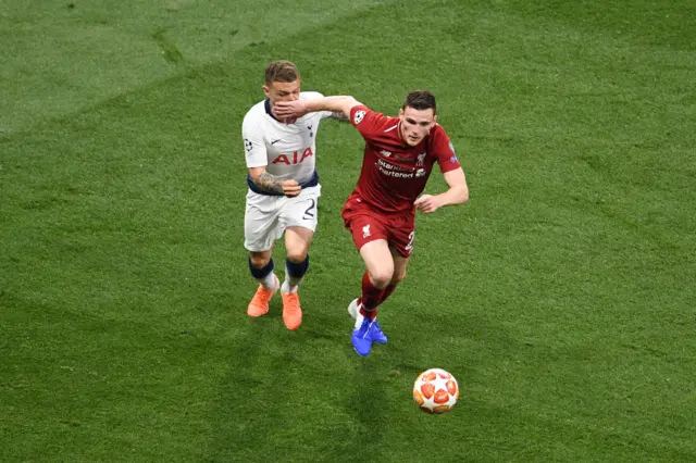 Andy Robertson puts his hand into the face of Kieran Trippier