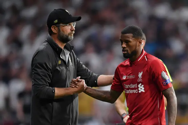 Jurgen Klopp and Gini Wijnaldum embrace as the Liverpool player is brought off