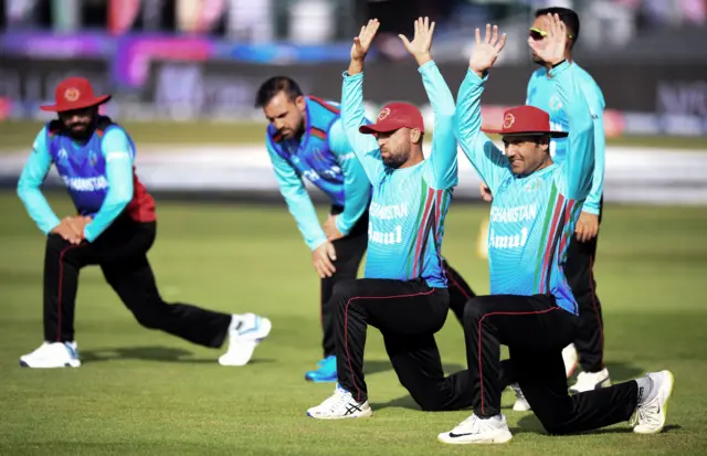 Afghanistan's Rashid Khan (C) takes part in a training session at The Bristol County Ground