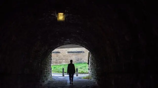 Stock image of a girl in a tunnel