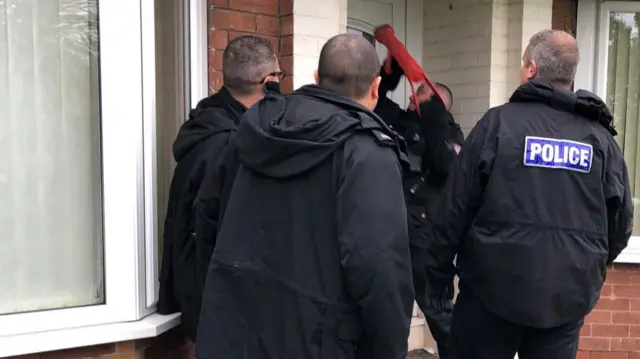 Officers carrying out a raid