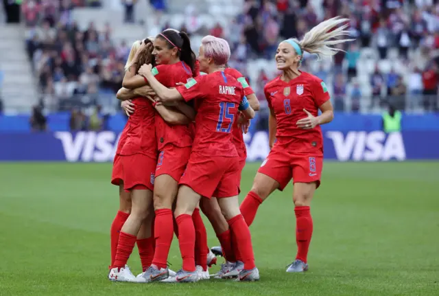 Alex Morgan of the USA celebrates with her teammates