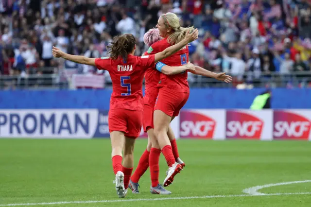 Lindsey Horan of the USA celebrates with teammates after scoring her team's third goal