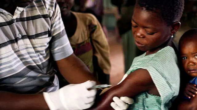 Woman getting measles vaccine