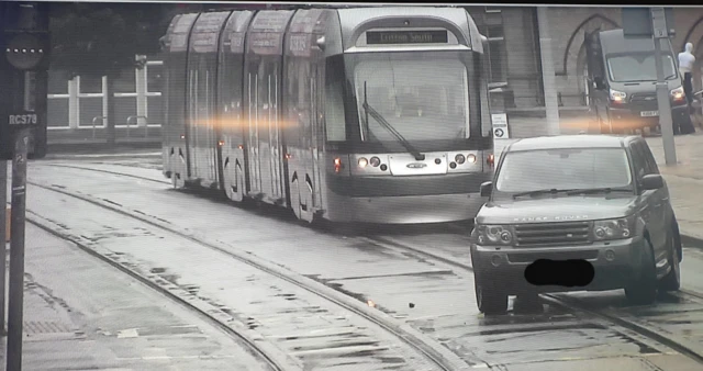 Car on tram tracks