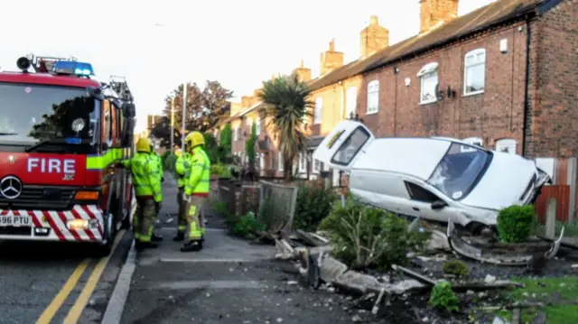 Van after crashing into gardens