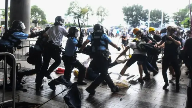 Police and protesters clash in Hong Kong