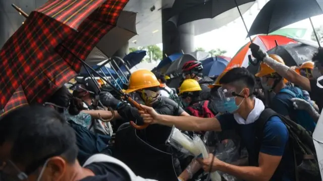 Protesters clash with police during a demonstration outside the Legislative Council Complex in Hong Kong on June 12, 2019