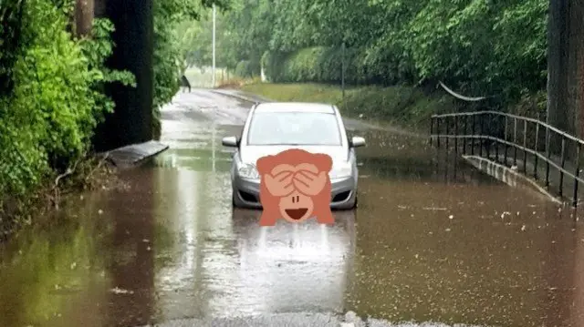 Car stuck in floodwater