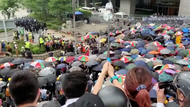 Protesters holding umbrellas take part in a demonstration against a proposed extradition bill, in Hong Kong, China, June 12, 2019