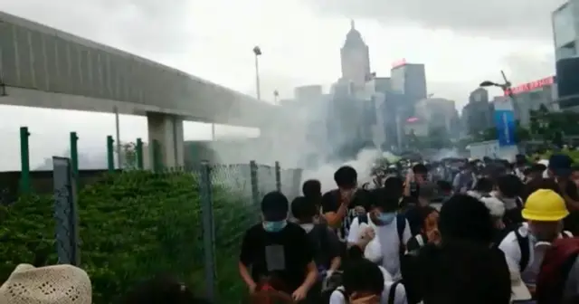 Protesters being tear-gassed