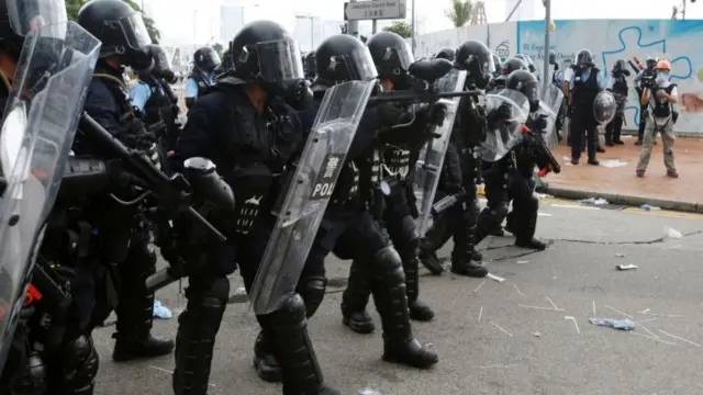 Riot police officers prepare for protesters during a demonstration against a proposed extradition bill, in Hong Kong, China June 12, 2019.