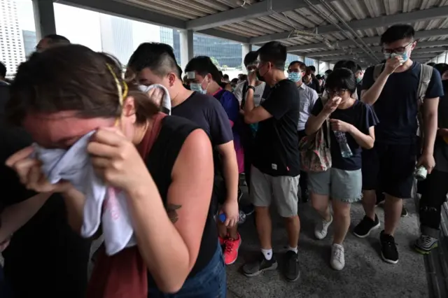 Protesters affected by tear gas during a demonstration against a proposed extradition bill in Hong Kong, China June 12, 2019.