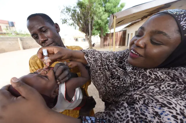 Nigerian getting polio vaccine