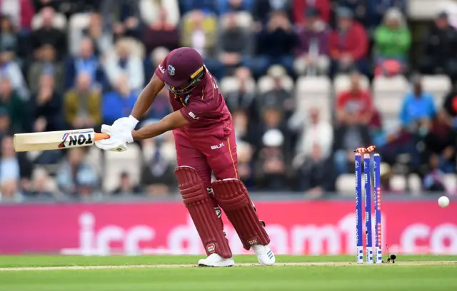 Evin Lewis of West Indies is bowled by Chris Woakes of England during the Group Stage match of the ICC Cricket World Cup 2019 between England and West Indies