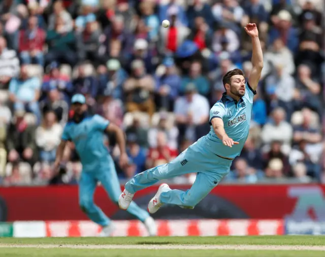 Mark Wood dives for the ball