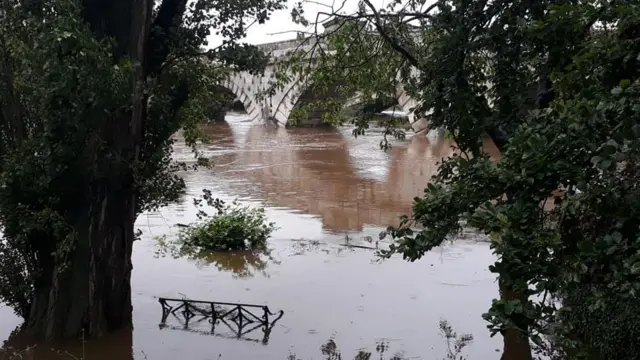 Bench almost underwater near Atcham