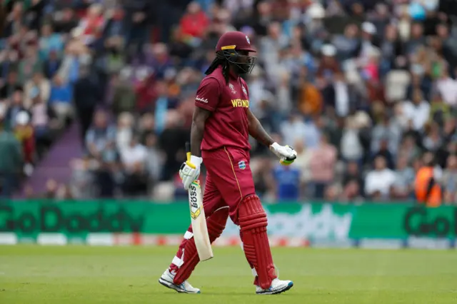 Chris Gayle walks off after losing his wicket